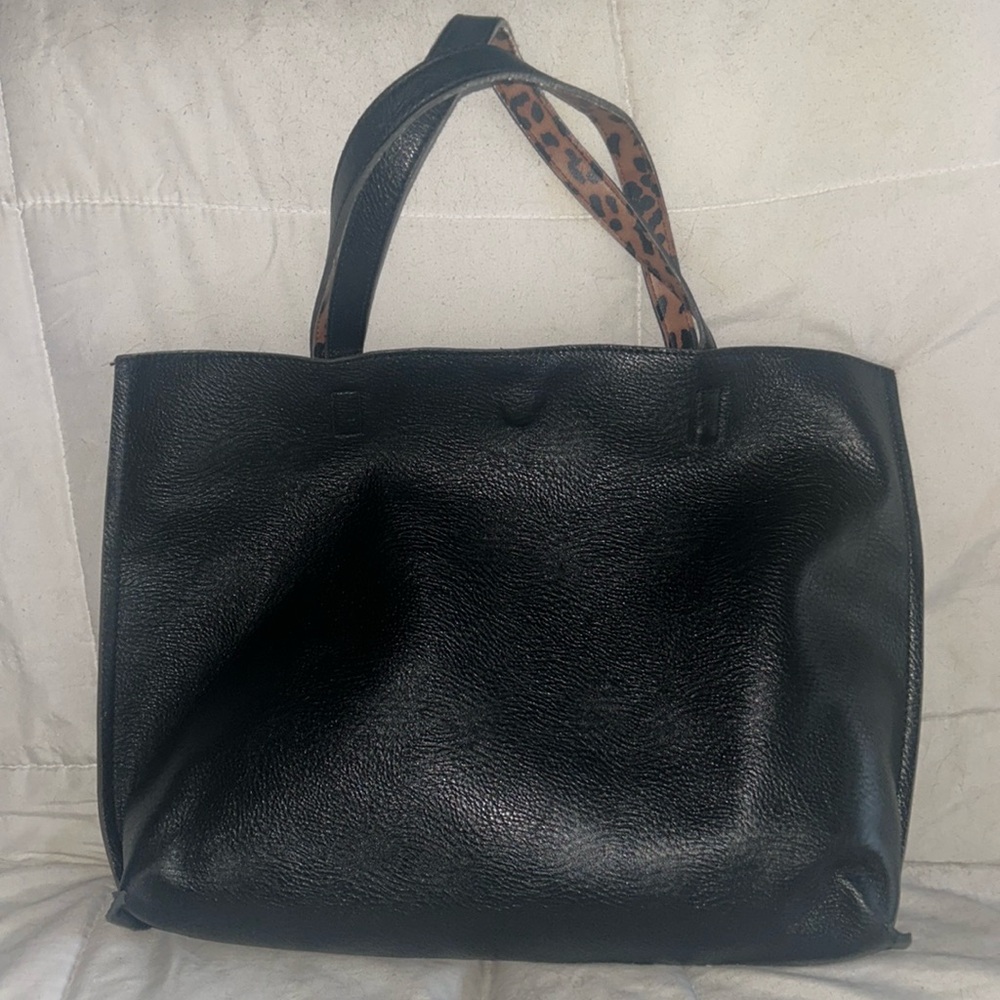 Street level bag this is a tote with wallet or baby clutch inside it